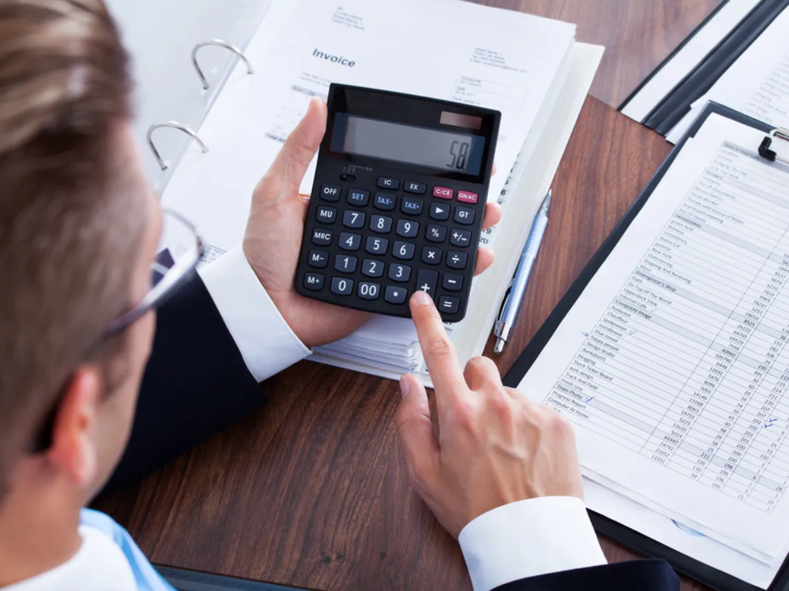 Tax consulting: calculator and invoices